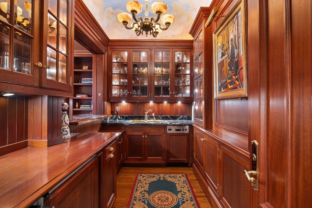 129 Commonwealth Avenue, Unit SF Boston, MA 02116 - Photo 10 of 19 a kitchen with stainless steel appliances granite countertop a refrigerator and a stove