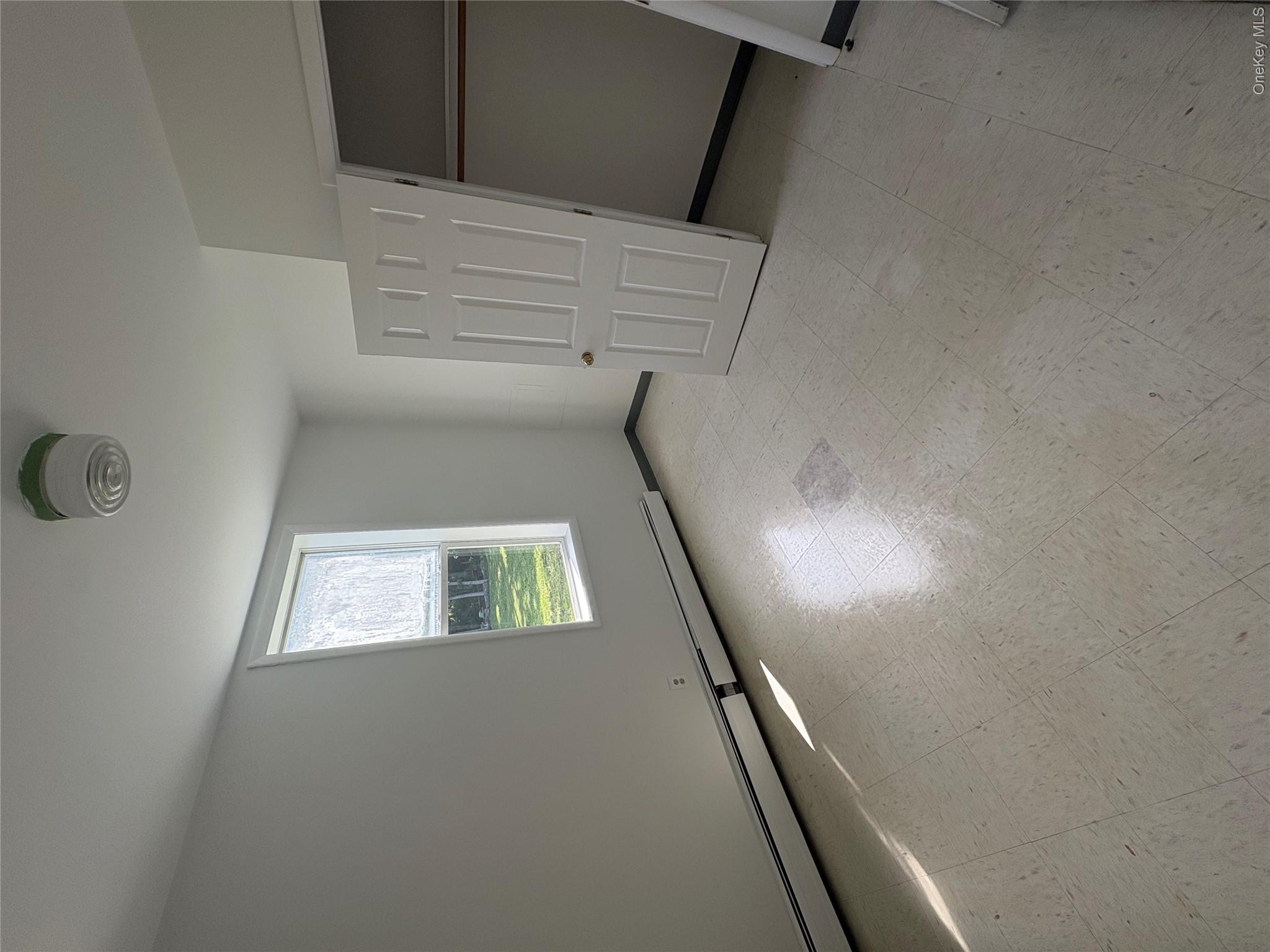 11 Fallkill Avenue Poughkeepsie, NY 12601 - Photo 5 of 9 an empty room with a window