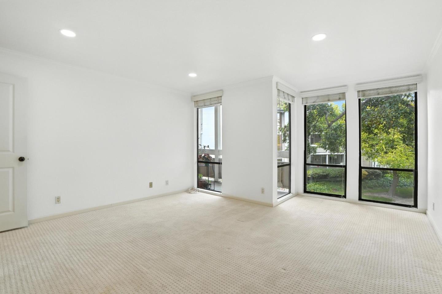 1171 Compass Lane, Unit 211 Foster City, CA 94404 - Photo 24 of 37 a view of an empty room with wooden floor and a window
