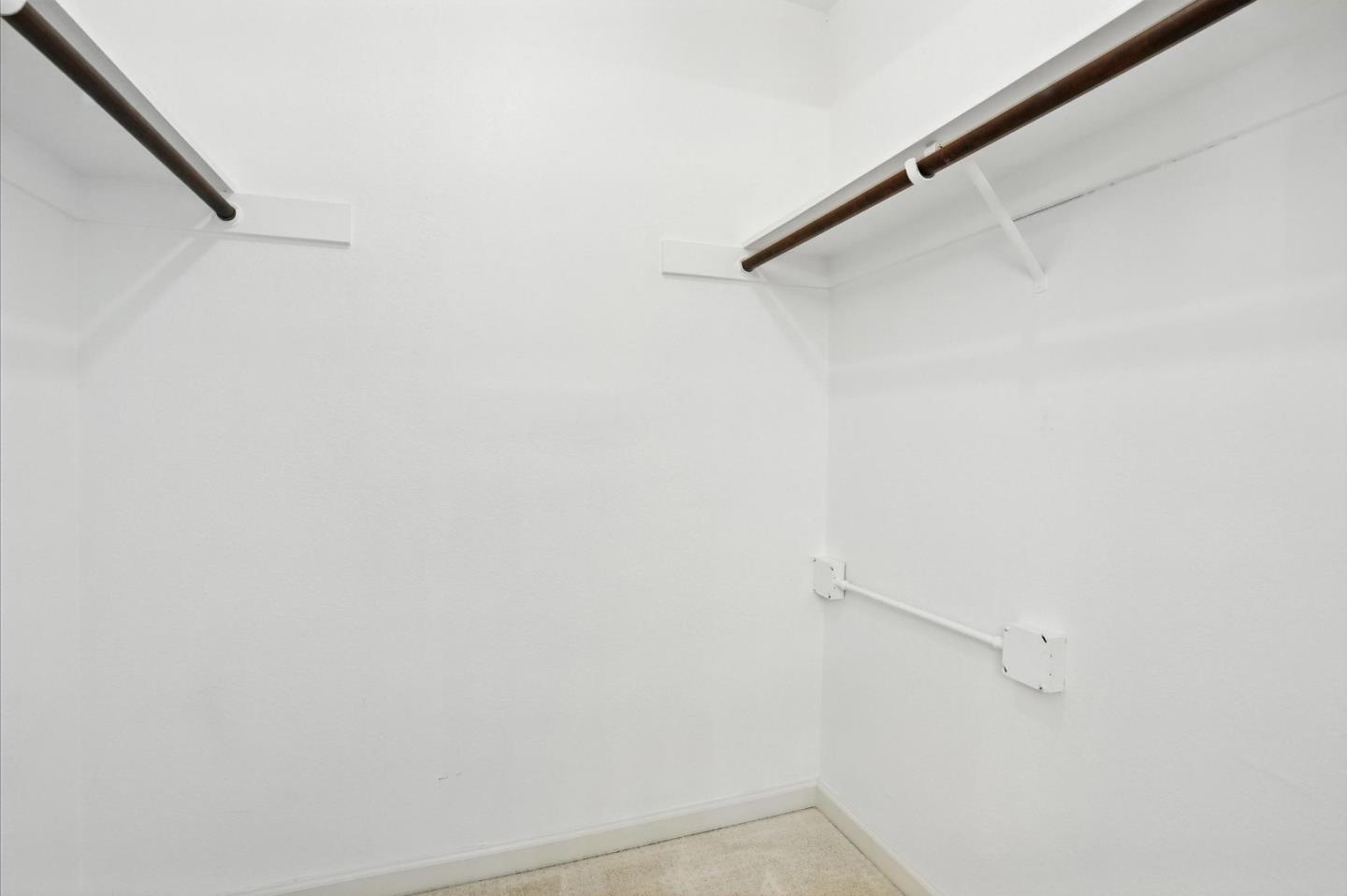 1171 Compass Lane, Unit 211 Foster City, CA 94404 - Photo 27 of 37 a view of small space with racks on the wall