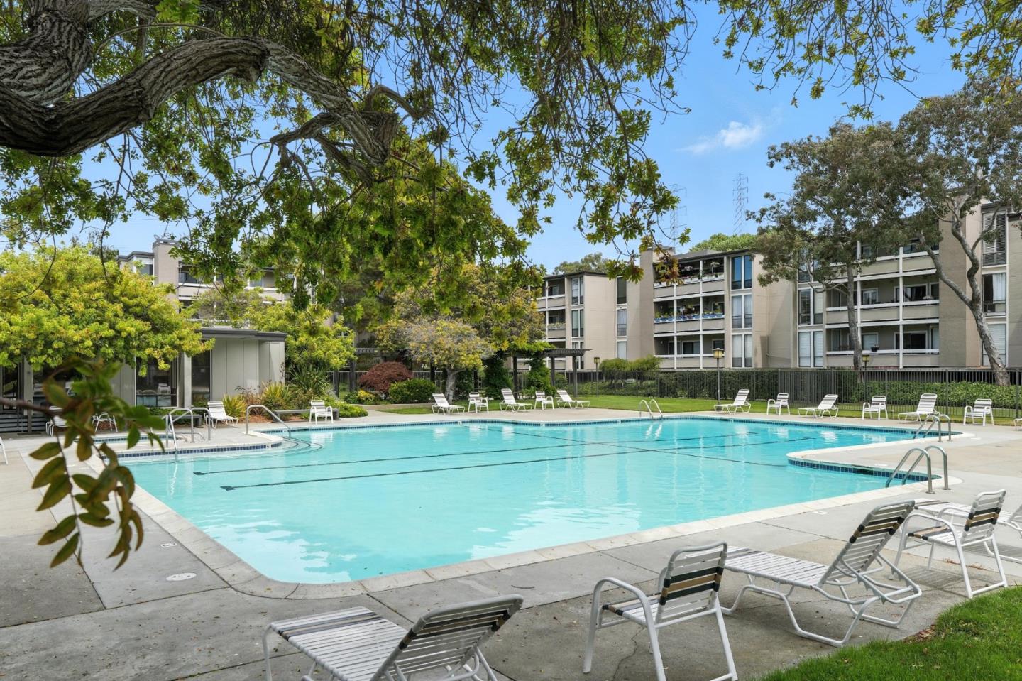 1171 Compass Lane, Unit 211 Foster City, CA 94404 - Photo 36 of 37 a view of a swimming pool with a lounge chairs