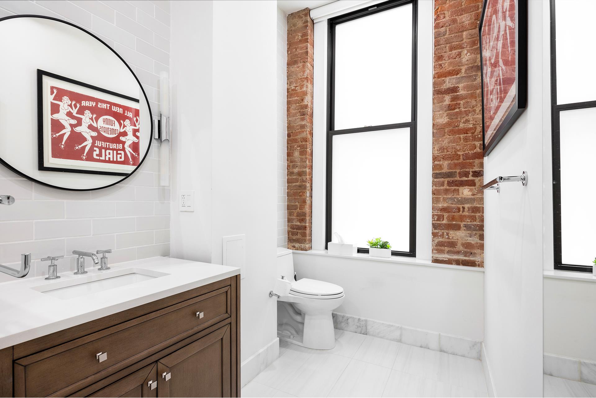 242 Lafayette Street, Unit 2N Manhattan, NY 10012 - Photo 11 of 13 a bathroom with a toilet sink and a mirror