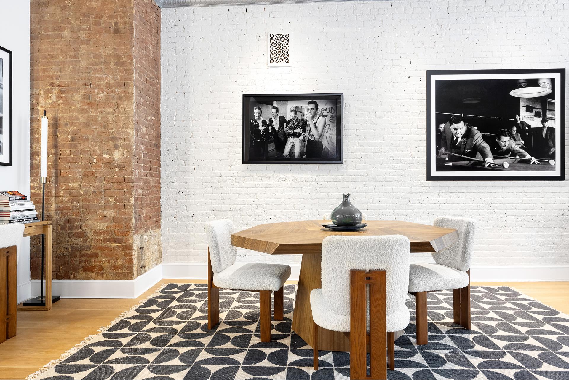 242 Lafayette Street, Unit 2N Manhattan, NY 10012 - Photo 8 of 13 a view of a dining room with furniture and wooden floor