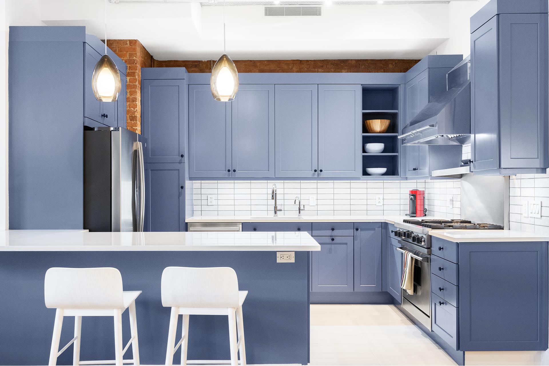 242 Lafayette Street, Unit 2N Manhattan, NY 10012 - Photo 9 of 13 a kitchen with a sink and cabinets