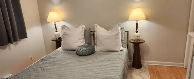 a view of a livingroom with furniture and a lamp