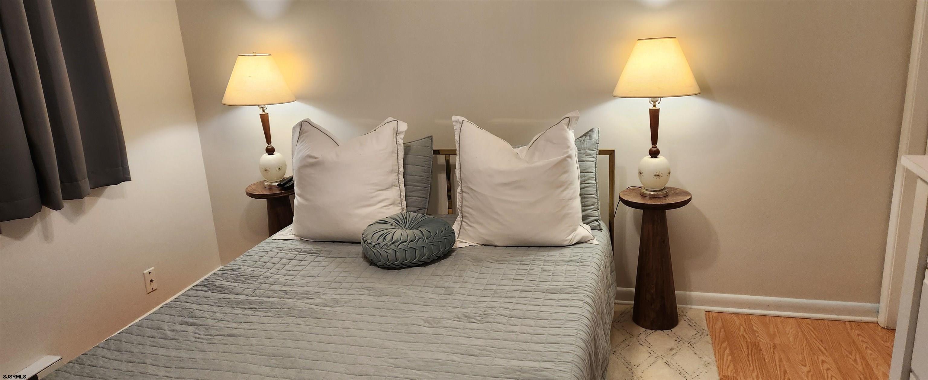 1013 West Brigantine Avenue, Unit 4 Brigantine, NJ 08203 - Photo 12 of 18 a view of a livingroom with furniture and a lamp