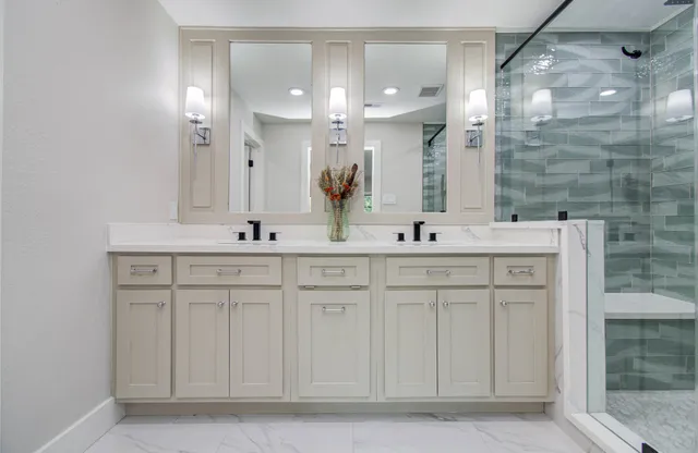 a bathroom with a sink vanity and mirror