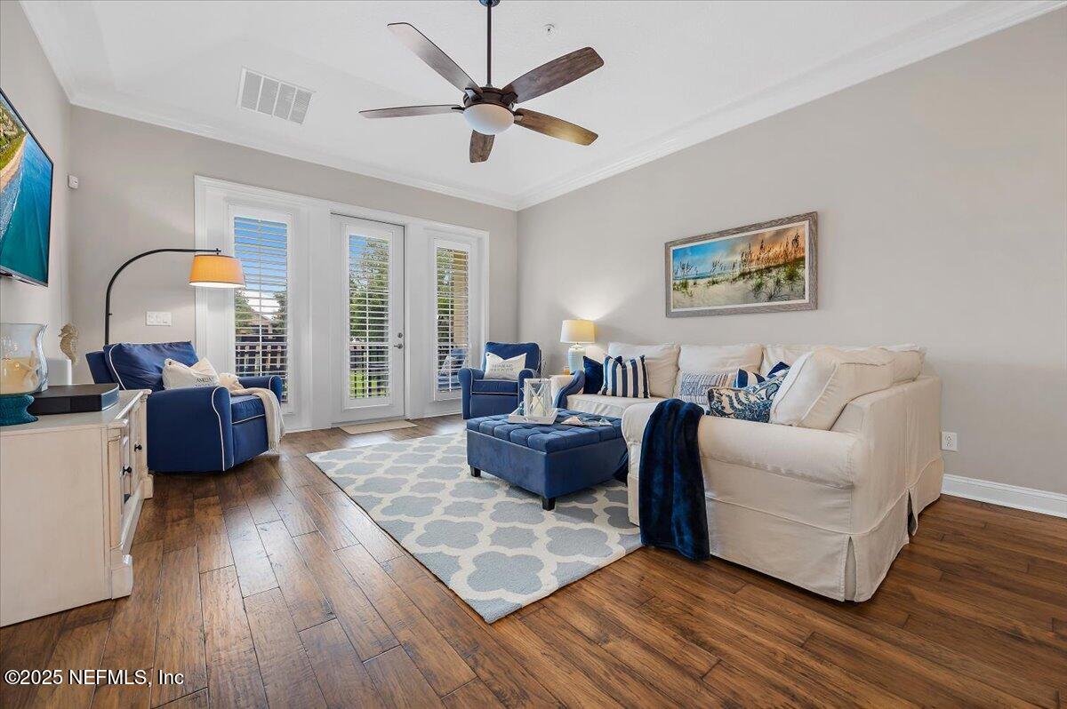 95220 Summerwoods Circle, Unit 1205 Fernandina Beach, FL 32034 - Photo 14 of 32 a living room with furniture and a window