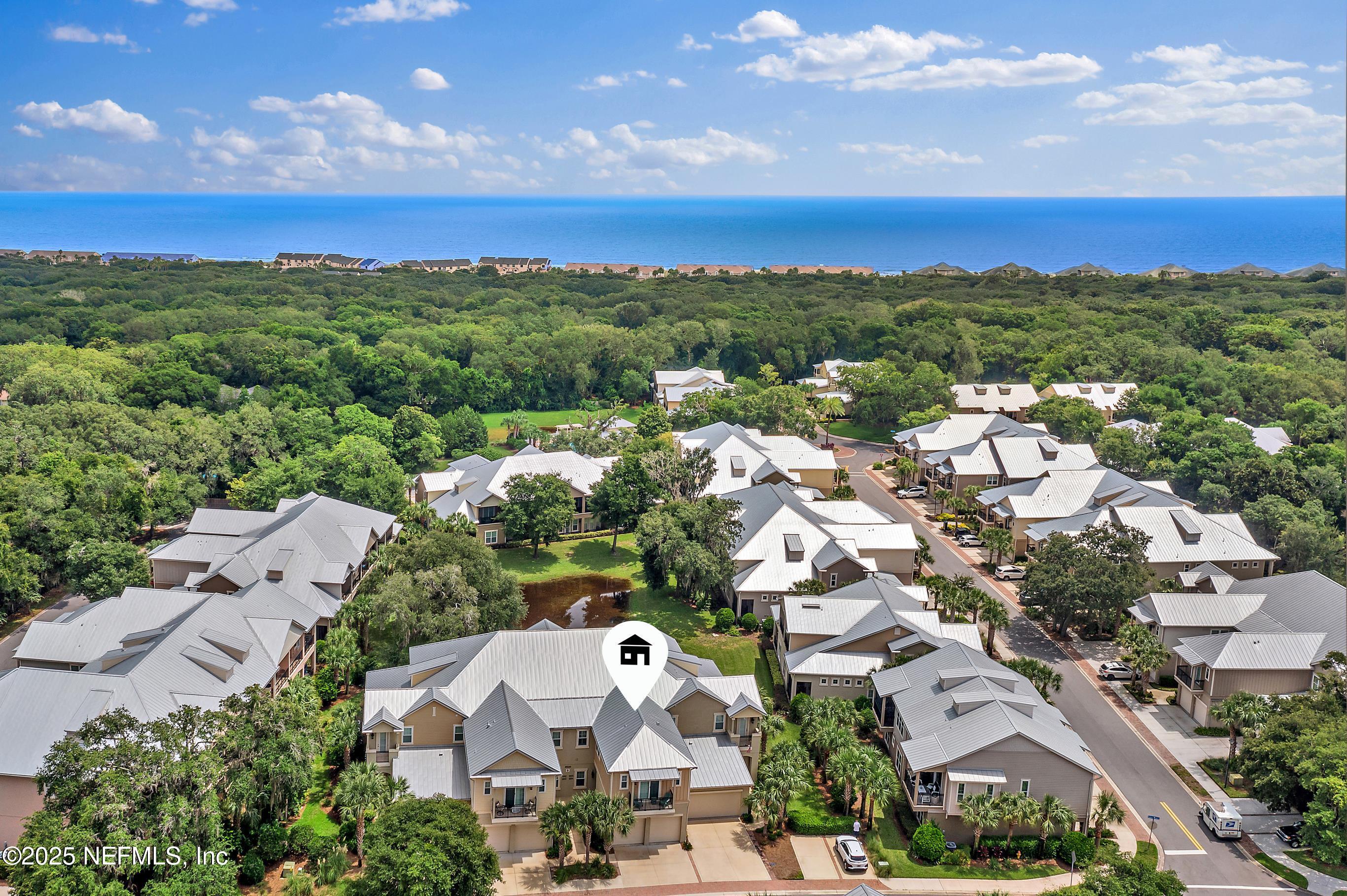 95220 Summerwoods Circle, Unit 1205 Fernandina Beach, FL 32034 - Photo 3 of 32 an aerial view of residential houses with outdoor space and street view