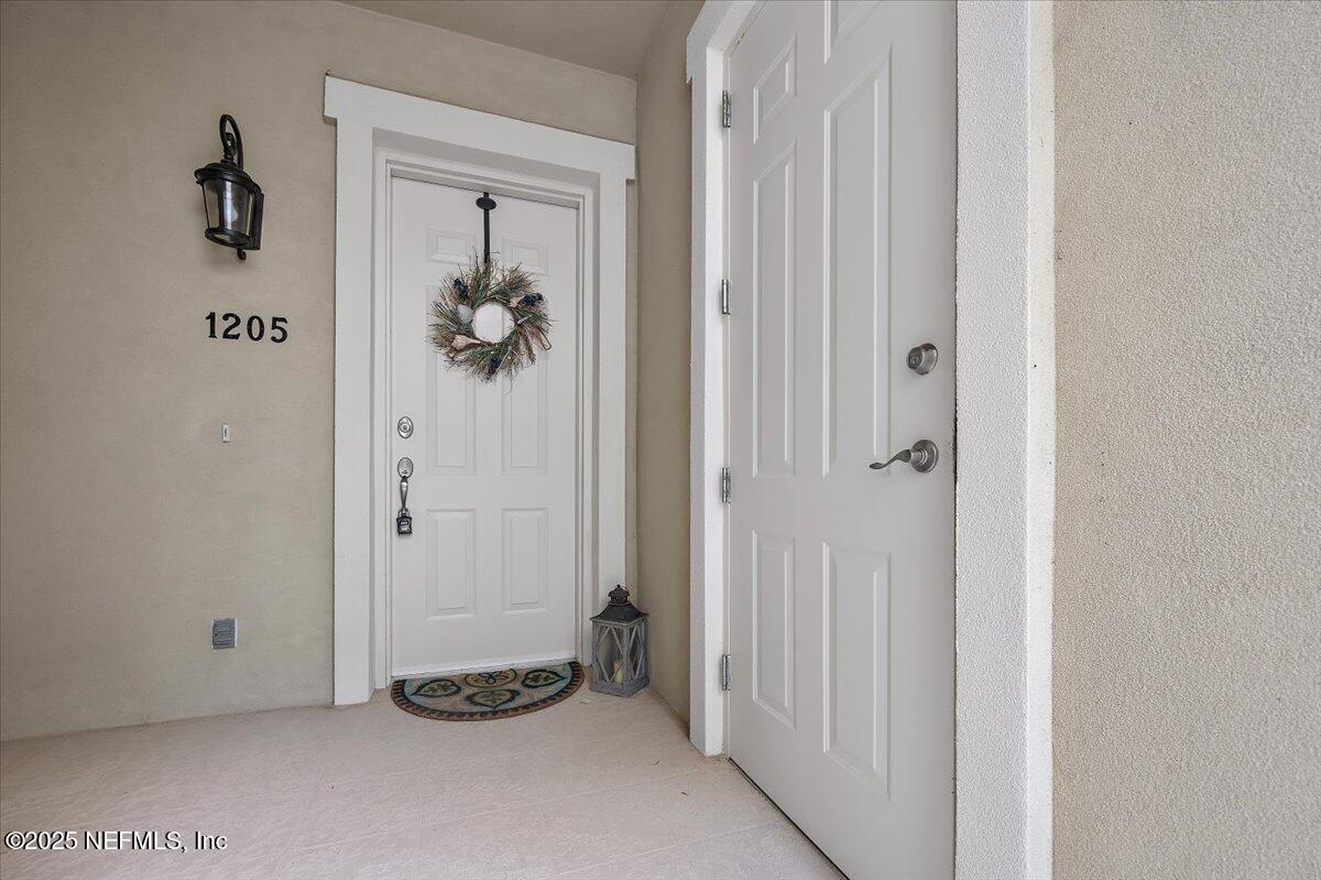 95220 Summerwoods Circle, Unit 1205 Fernandina Beach, FL 32034 - Photo 7 of 32 a view of a hallway with closet