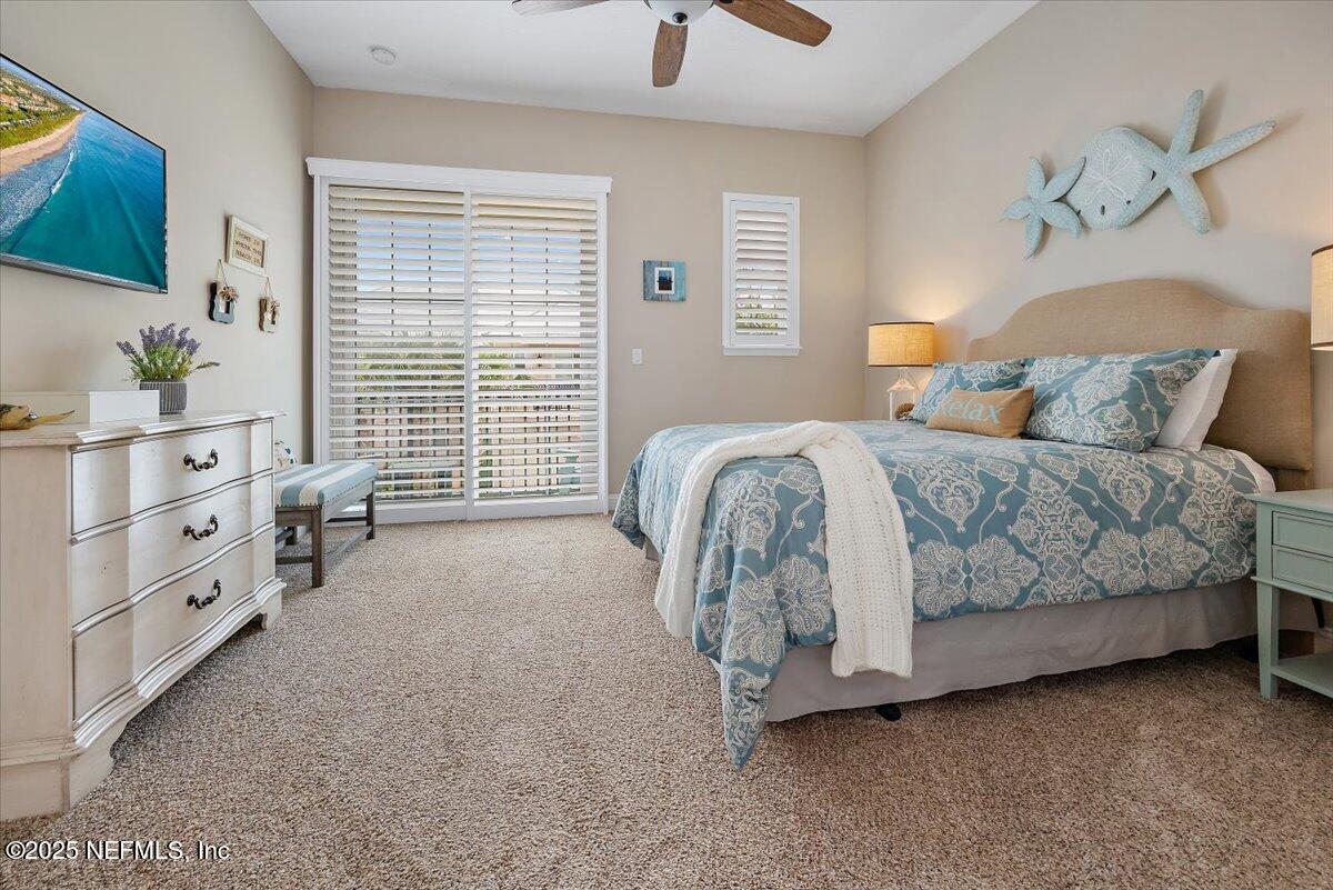 95220 Summerwoods Circle, Unit 1205 Fernandina Beach, FL 32034 - Photo 10 of 32 a bedroom with a bed and a window