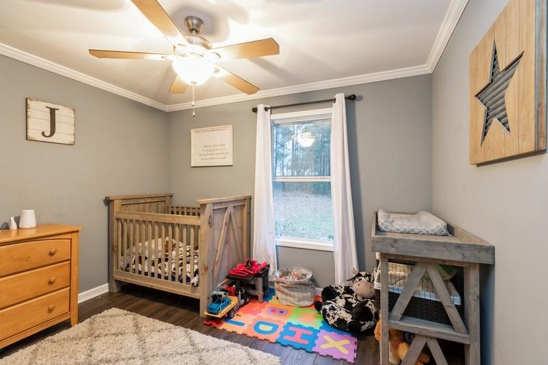 6124 Beasley Road Crestview, FL 32536 - Photo 12 of 20 a bedroom with furniture and a window