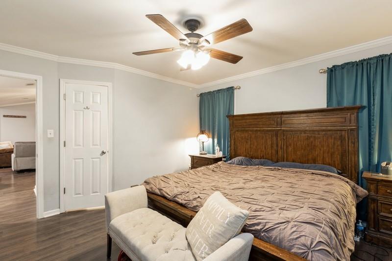 6124 Beasley Road Crestview, FL 32536 - Photo 15 of 20 a bedroom with a bed and a ceiling fan