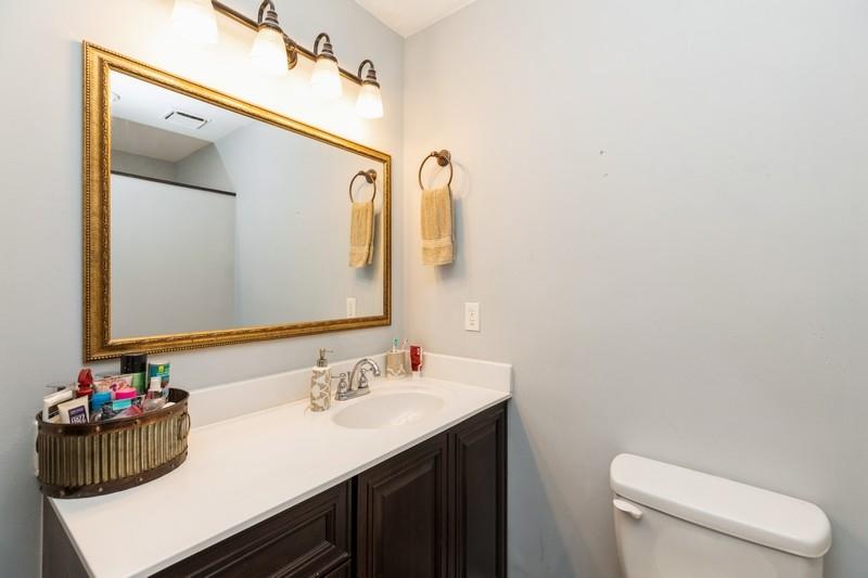 6124 Beasley Road Crestview, FL 32536 - Photo 17 of 20 a bathroom with a sink vanity mirror and toilet