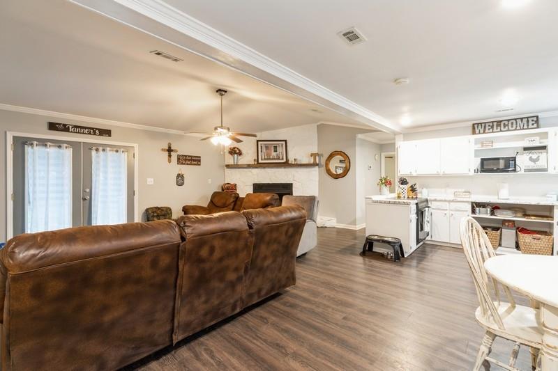 6124 Beasley Road Crestview, FL 32536 - Photo 2 of 20 a living room with furniture and kitchen view