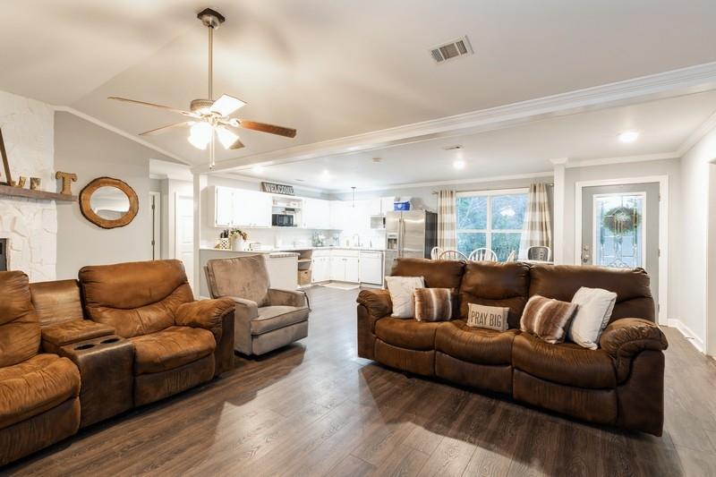 6124 Beasley Road Crestview, FL 32536 - Photo 9 of 20 a living room with furniture kitchen view and a chandelier