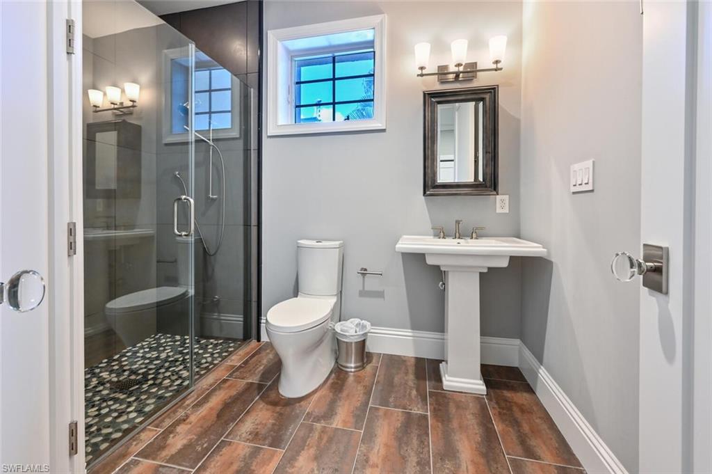 433 5th Street South Naples, FL 34102 - Photo 5 of 39 a bathroom with a sink toilet and shower
