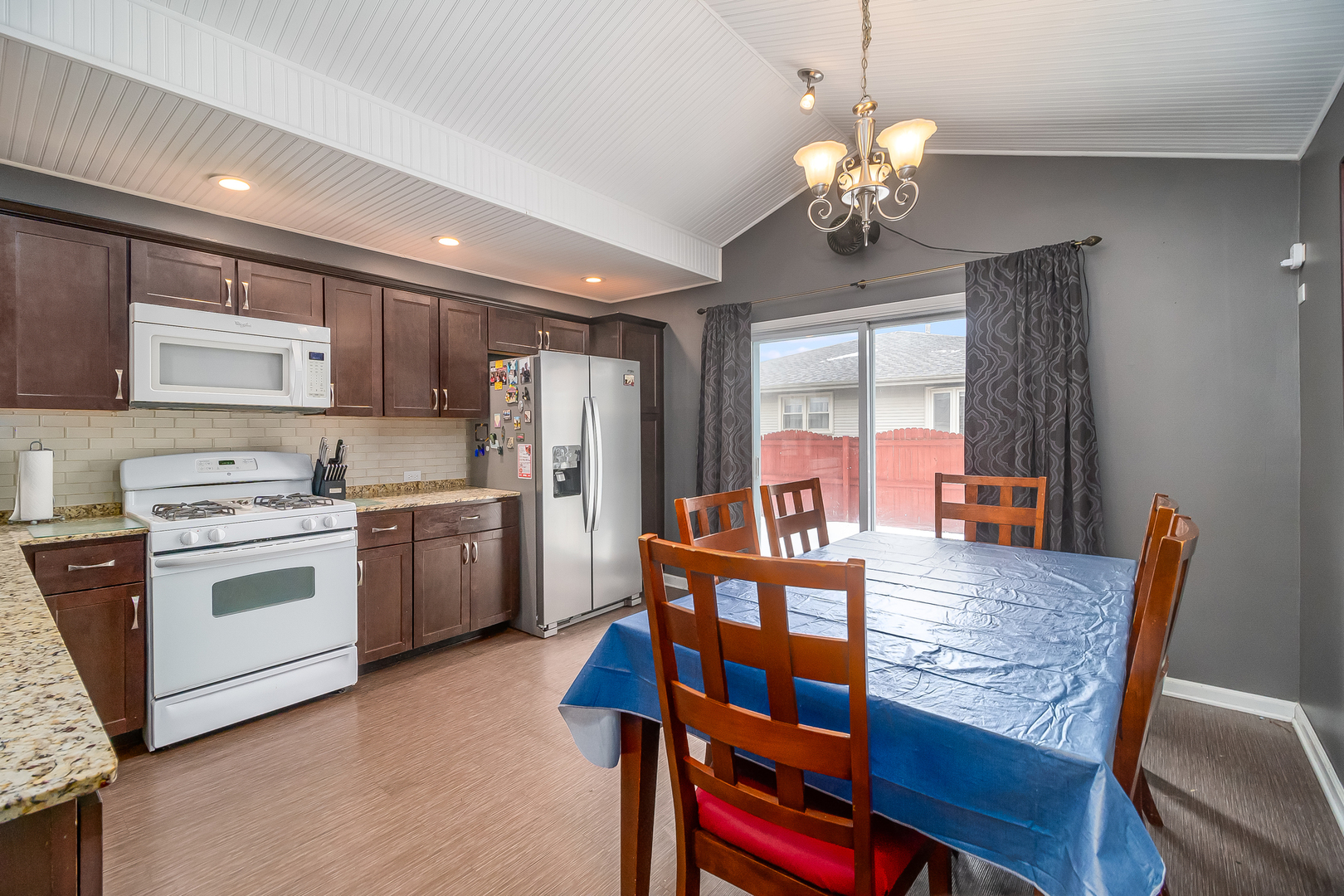 805 South Cooper Road New Lenox, IL 60451 - Photo 11 of 25 a view of kitchen with refrigerator dining table and chairs