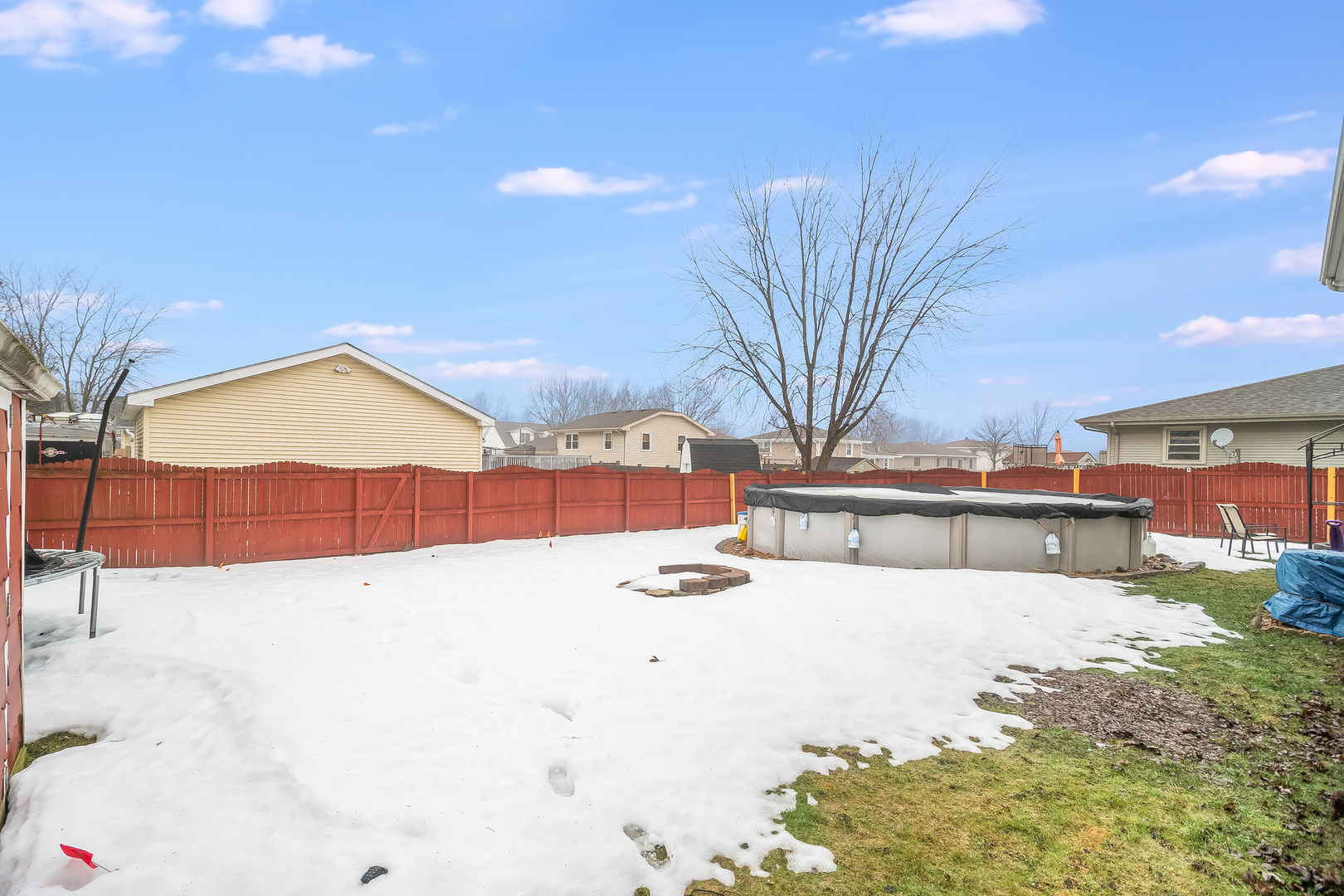 805 South Cooper Road New Lenox, IL 60451 - Photo 3 of 25 a view of a backyard of snow and trees