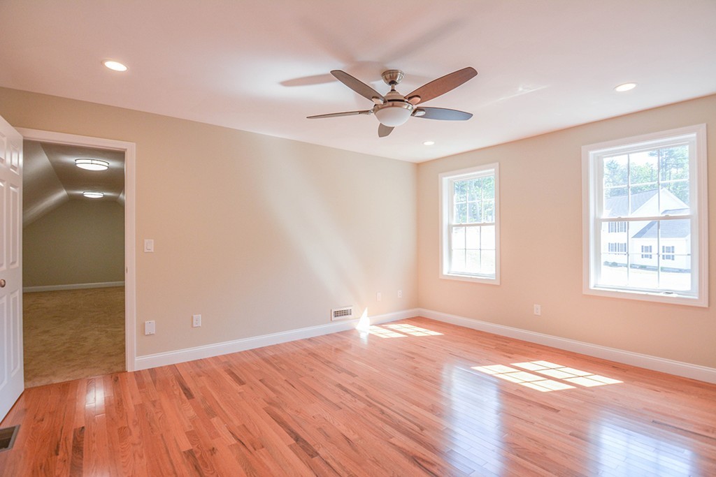 Lot 3 Tavern Road Groton, MA 01450 - Photo 11 of 25 a view of an empty room with wooden floor and a window