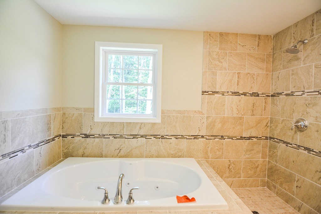 Lot 3 Tavern Road Groton, MA 01450 - Photo 14 of 25 a bath tub sitting next to a window