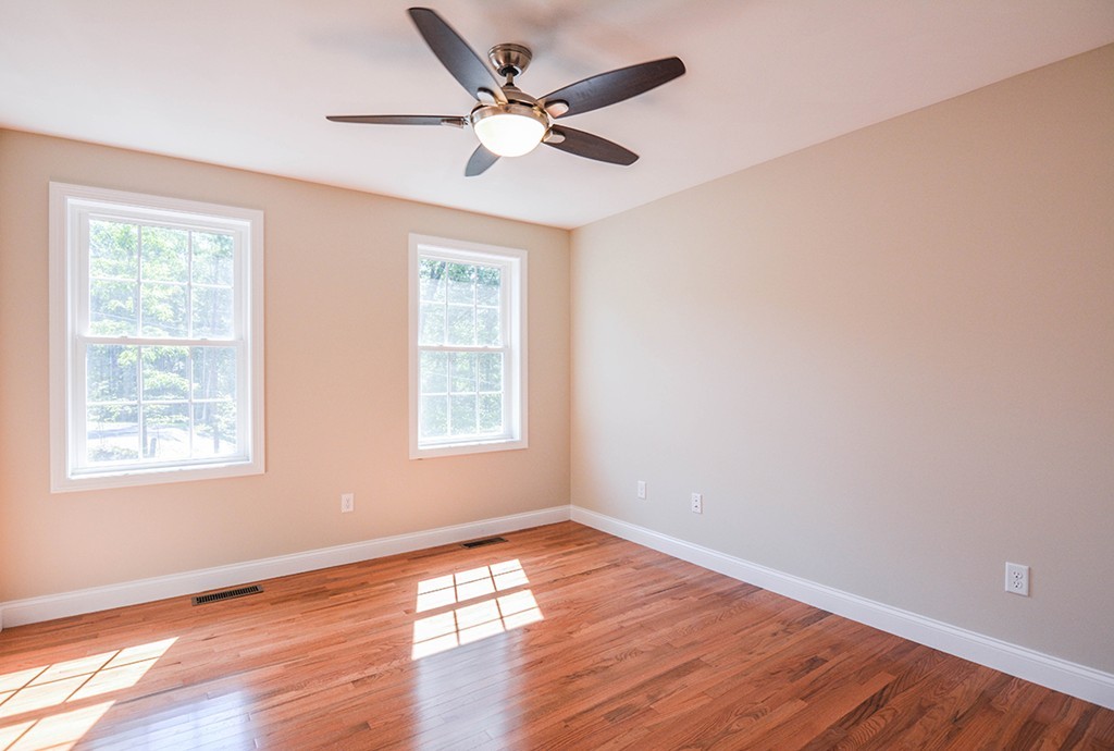 Lot 3 Tavern Road Groton, MA 01450 - Photo 16 of 25 a view of an empty room with wooden floor and a window