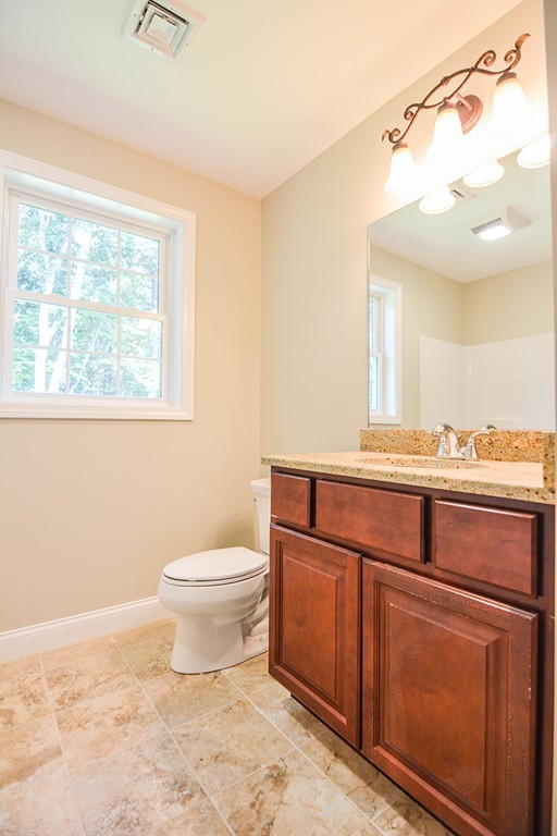 Lot 3 Tavern Road Groton, MA 01450 - Photo 18 of 25 a bathroom with a sink a toilet and mirror