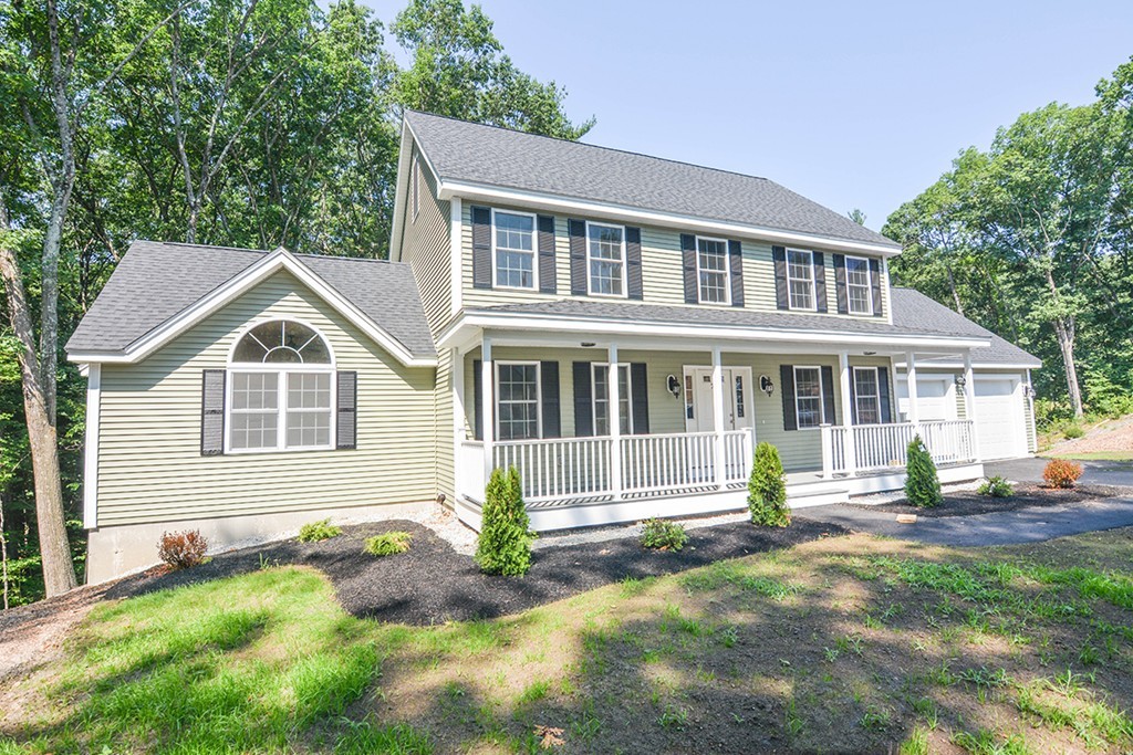 Lot 3 Tavern Road Groton, MA 01450 - Photo 2 of 25 a front view of a house with a yard and porch