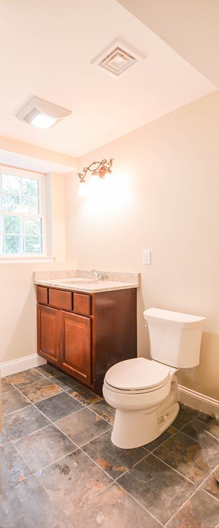 Lot 3 Tavern Road Groton, MA 01450 - Photo 21 of 25 a white toilet sitting next to a bathroom sink and a window