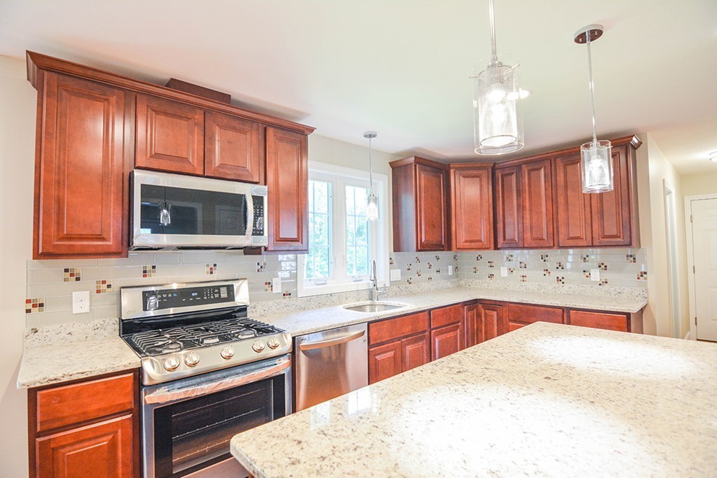 Lot 3 Tavern Road Groton, MA 01450 - Photo 3 of 25 a kitchen with a stove a sink and a microwave