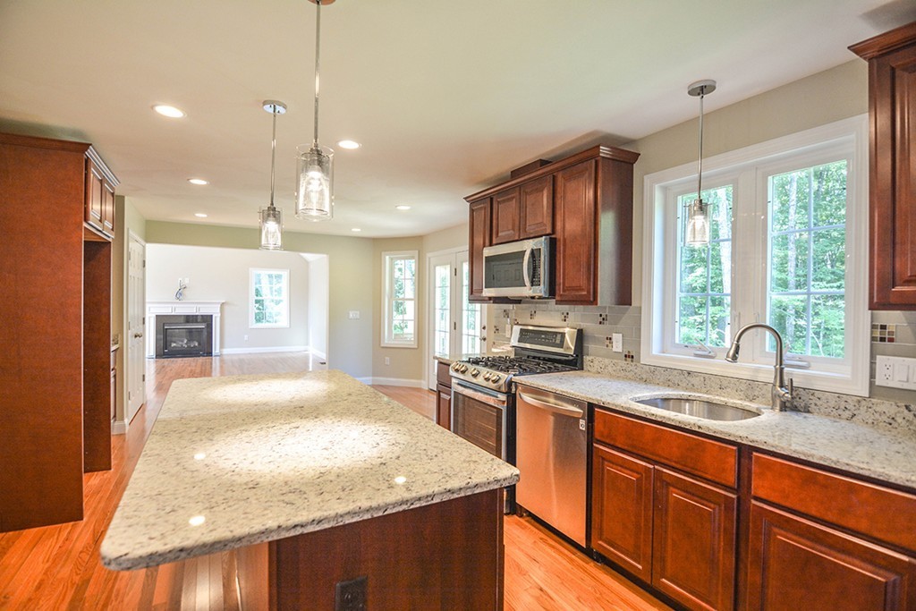 Lot 3 Tavern Road Groton, MA 01450 - Photo 4 of 25 a kitchen with stainless steel appliances granite countertop sink stove top oven and refrigerator