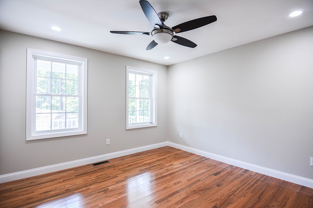 Lot 3 Tavern Road Groton, MA 01450 - Photo 7 of 25 an empty room with wooden floor fan and windows