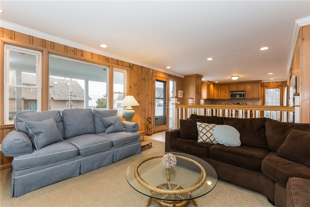 26 Dunes Road Narragansett, RI 02882 - Photo 15 of 40 LIVING ROOM WITH A SNEAK PEAK OF THE KITCHEN AND DECK
