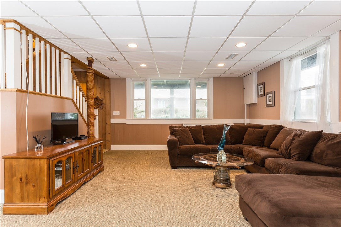 26 Dunes Road Narragansett, RI 02882 - Photo 23 of 40 FAMILY ROOM- PLENTY OF SPACE FOR RELAXING AFTER A LONG DAY AT THE BEACH....BEFORE KICKING YOUR FEET UP, DON'T FORGET TO RINSE OFF ALL THAT BEACH SAND IN YOUR OUTDOOR SHOWER!