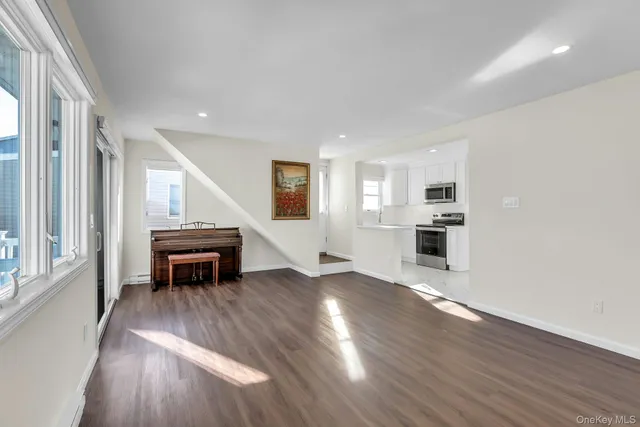 a view of kitchen and wooden floor
