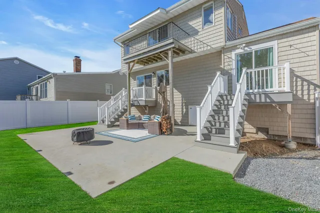 a view of a house with a yard and deck