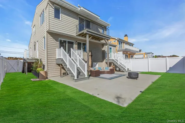 a view of a patio with a table and chairs