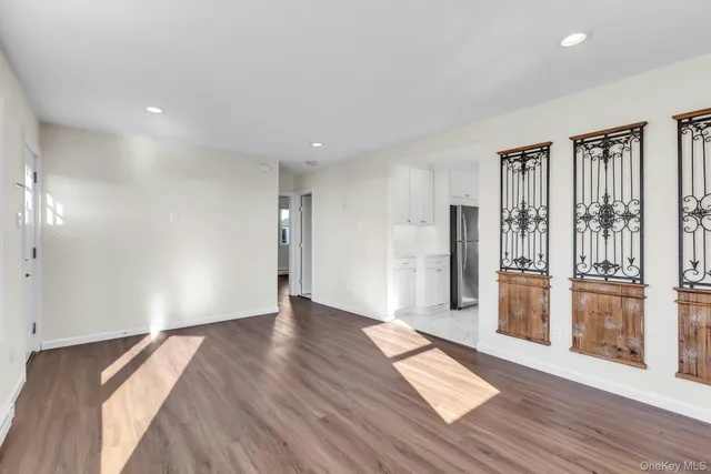 a view of entryway with wooden floor
