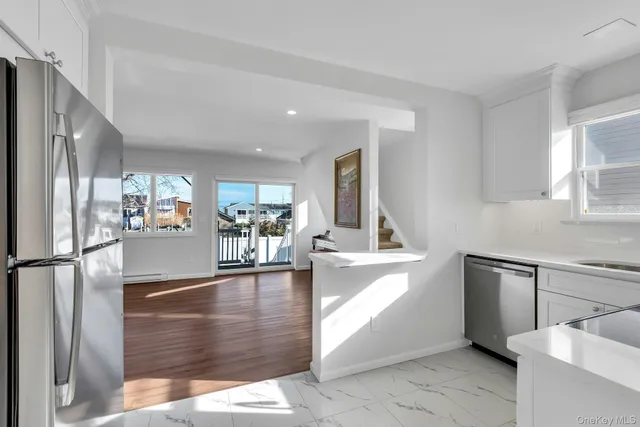 a view of a kitchen with a sink