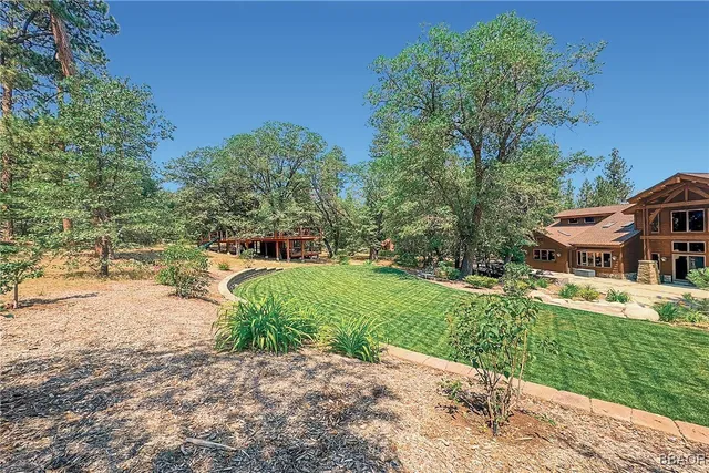 a front view of a house with a street