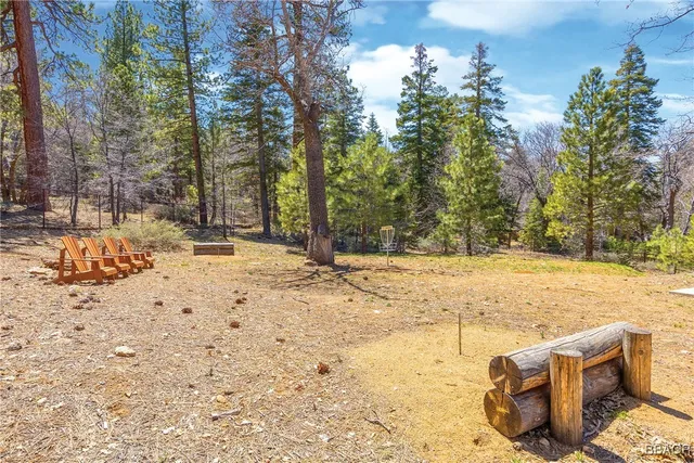 a view of backyard with a table and chairs