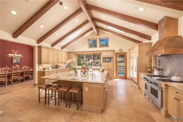a kitchen with lots of counter top space and dining table