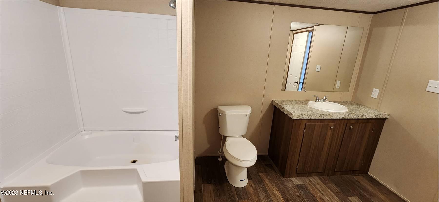 134 Juniper Road Georgetown, FL 32139 - Photo 12 of 20 a bathroom with a sink a toilet and shower