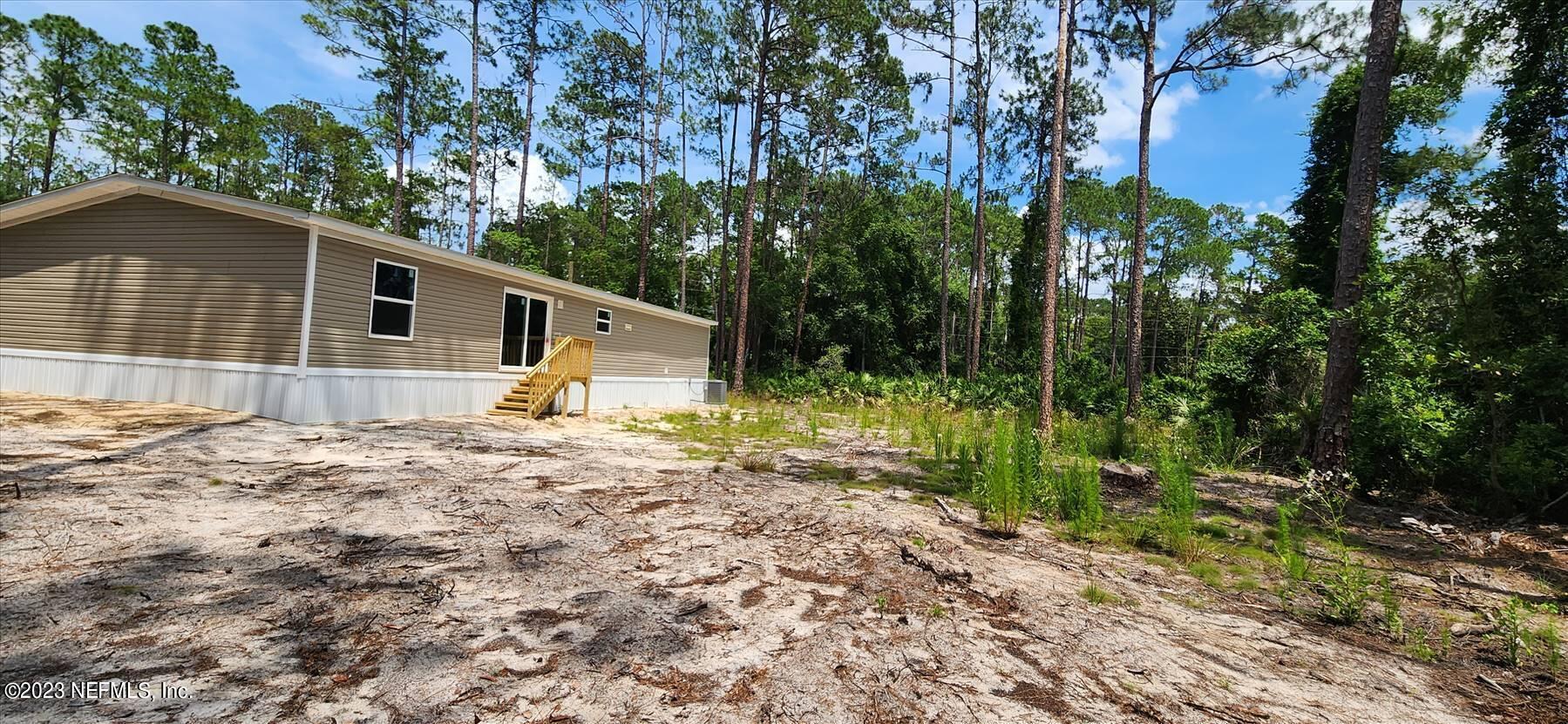 134 Juniper Road Georgetown, FL 32139 - Photo 8 of 20 a front view of a house with garden