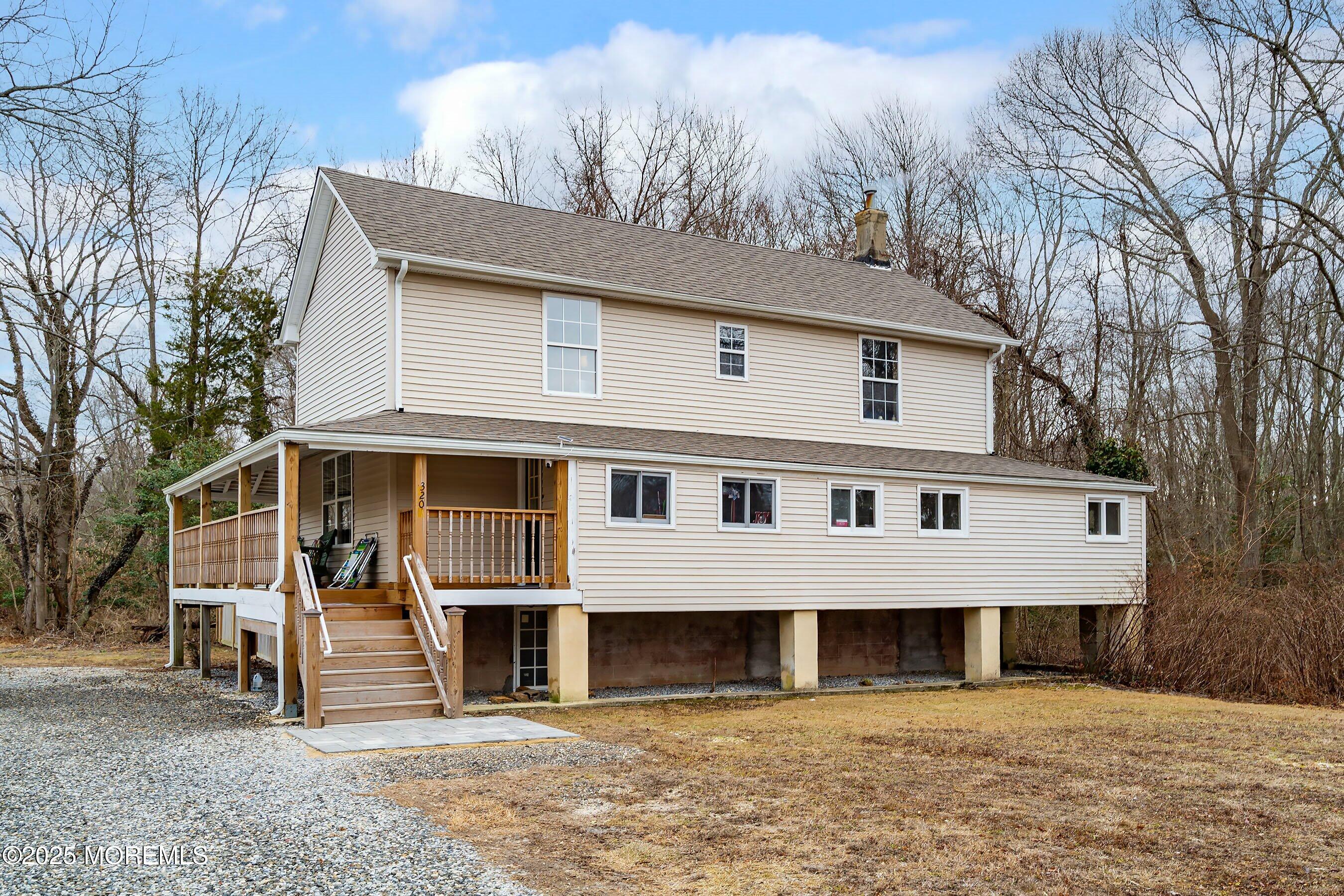 Main Street Barnegat, NJ 08005 - Photo 2 of 26 a front view of a house with large windows
