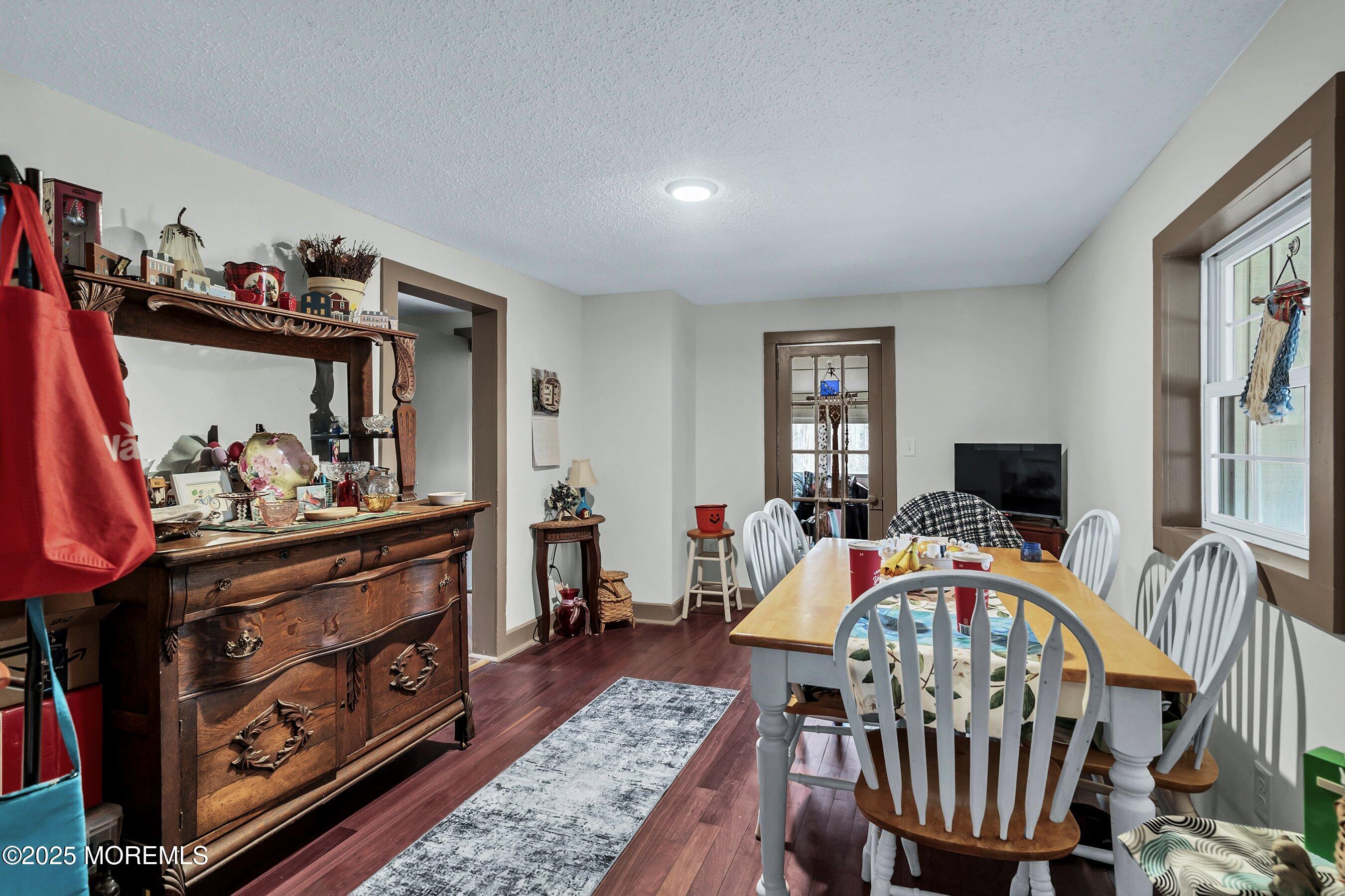 Main Street Barnegat, NJ 08005 - Photo 8 of 26 a living room with furniture a flat screen tv and a dresser
