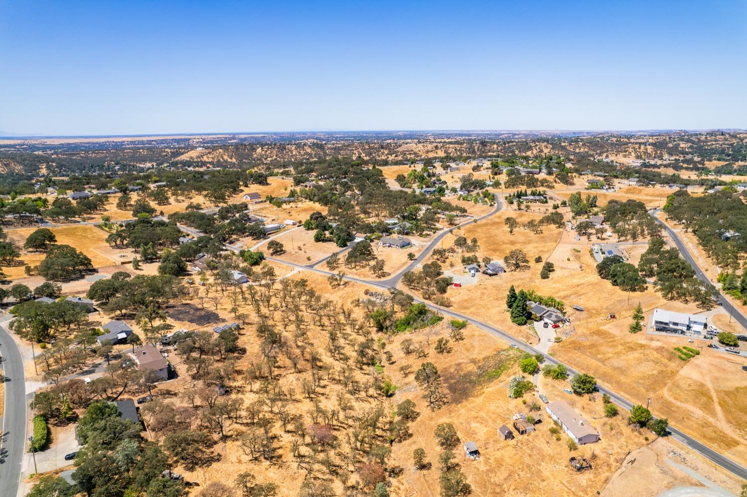 5015 Bane Road Valley Springs, CA 95252 - Photo 14 of 20 an aerial view of residential building and parking space