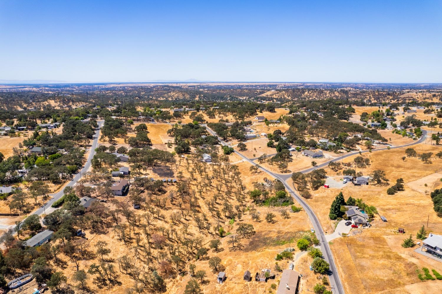 5015 Bane Road Valley Springs, CA 95252 - Photo 15 of 20 an aerial view of residential building with trees in the background