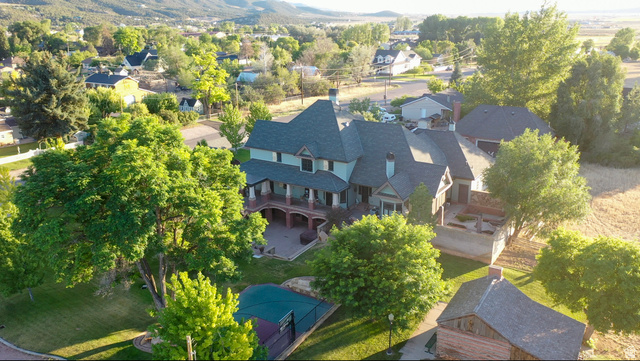 426 West Center Street Parowan, UT 84761 - Photo 98 of 107 Expansive property featuring a multi-story residence with a covered front porch and a private rear patio