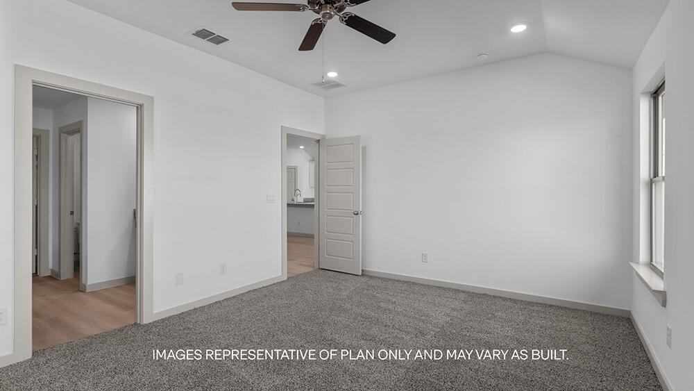 7445 9th Street Lubbock, TX 79416 - Photo 9 of 16 an empty room with a ceiling fan and window